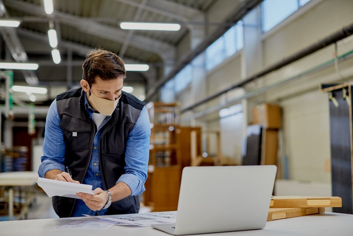 manufacturing employee looking at email