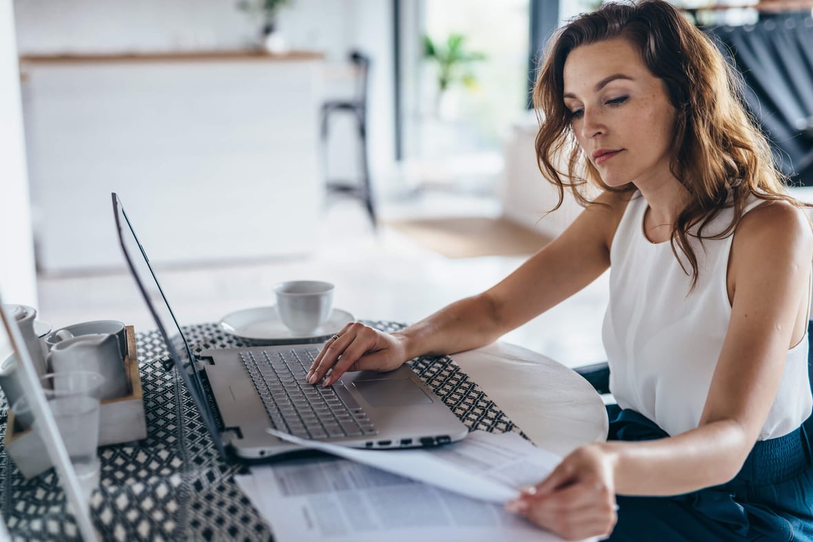 Woman on computer working on CRM data cleaning