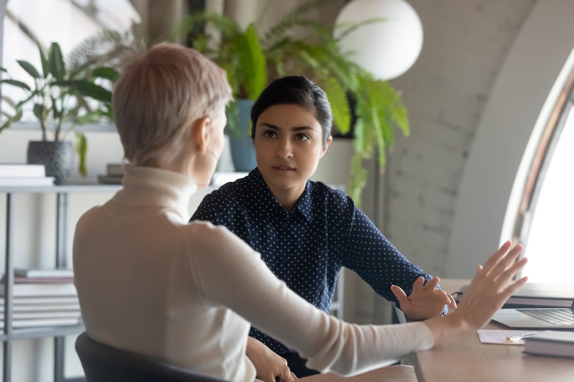 Two colleagues discussing sales and revenue operations