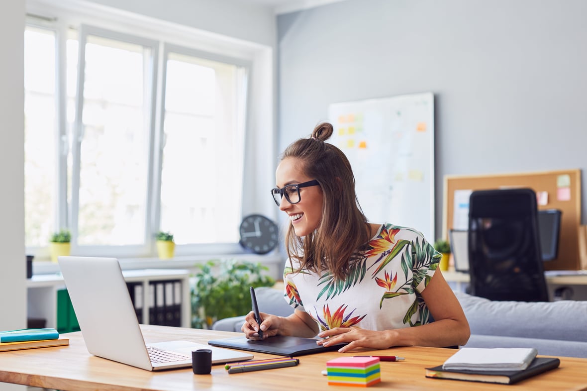 Woman working on her computer at desk 