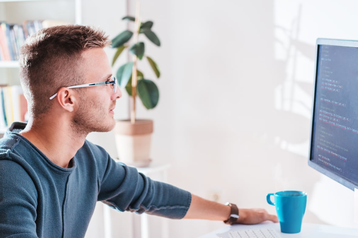 Marketer looking at his computer screen