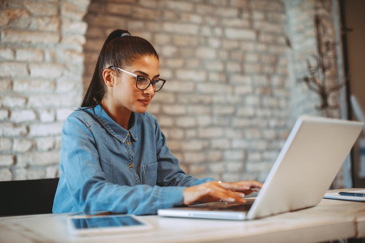 Woman on laptop using Klaviyo for email marketing
