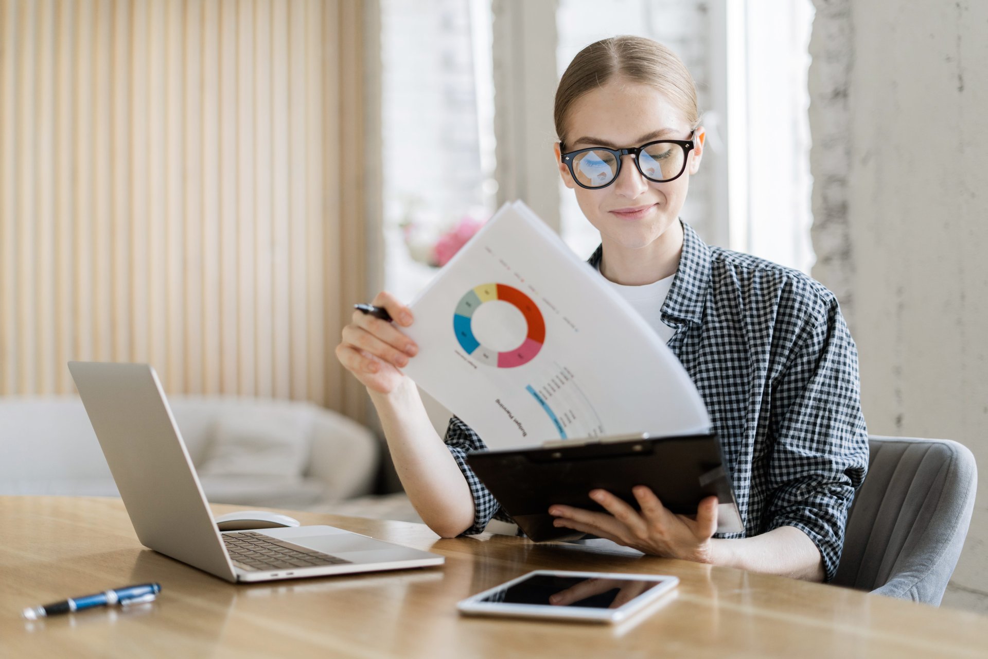 Person looking at documents at their desk