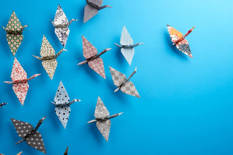 Origami birds flying in same direction