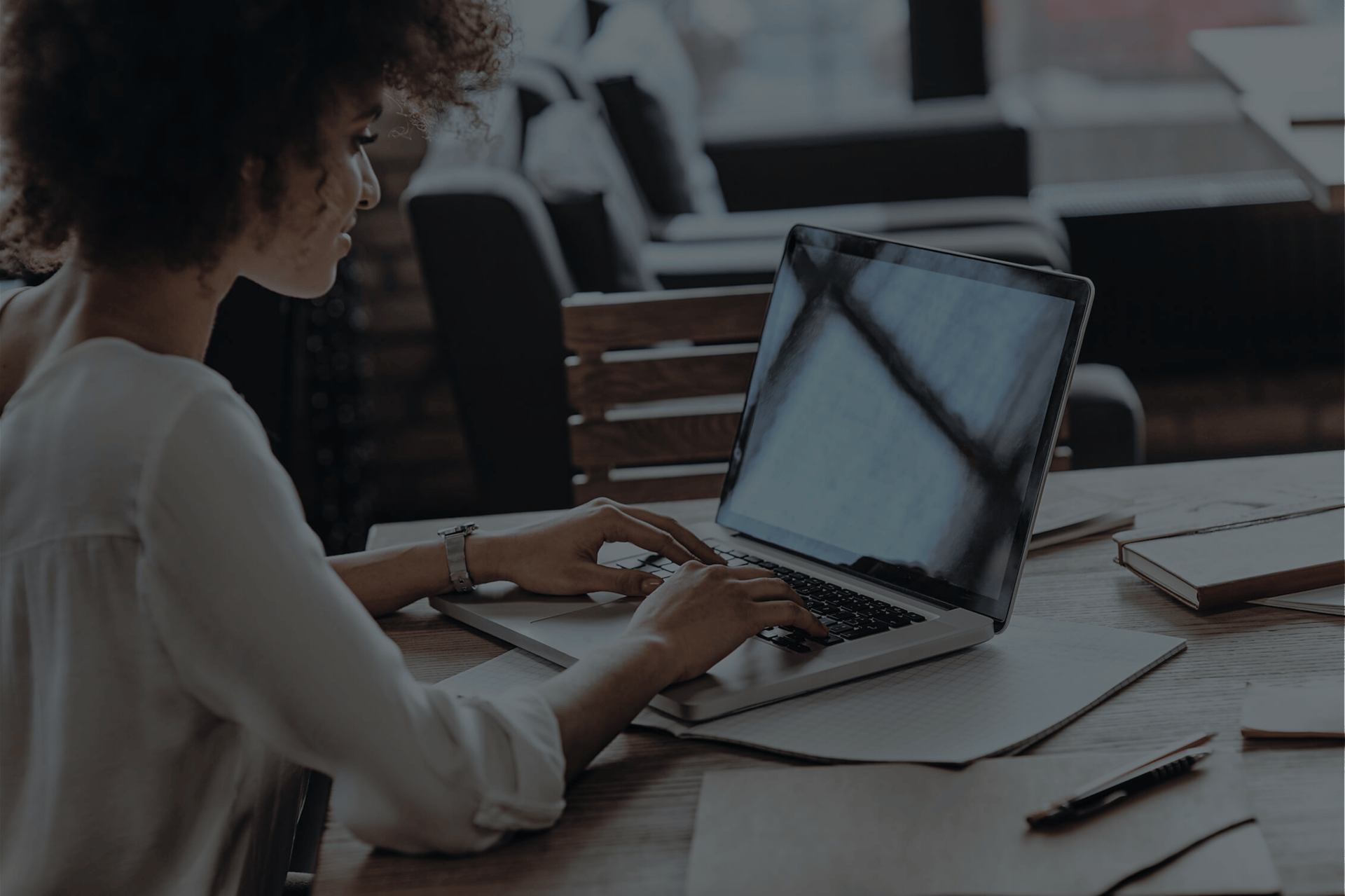 employee typing on a laptop