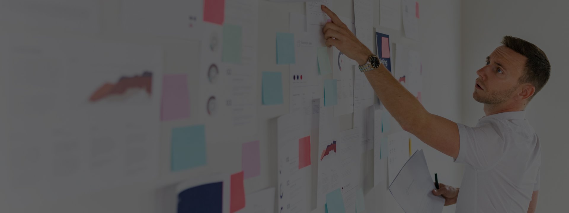 Man pointing on a white board