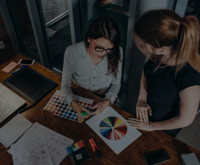 Employees looking at a color wheel