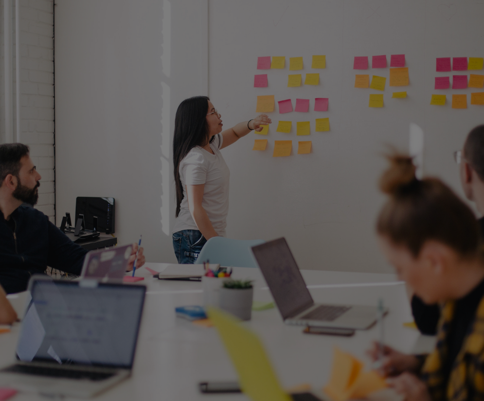 Employees brainstorming on a white board