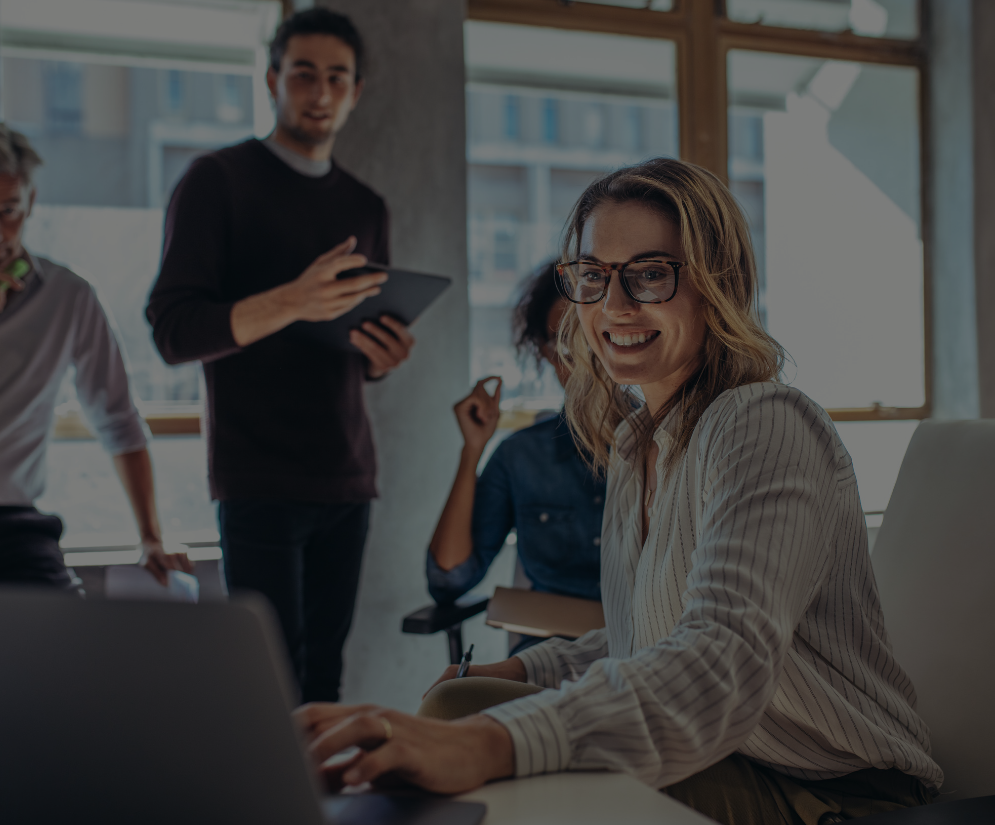 Employees smiling and working