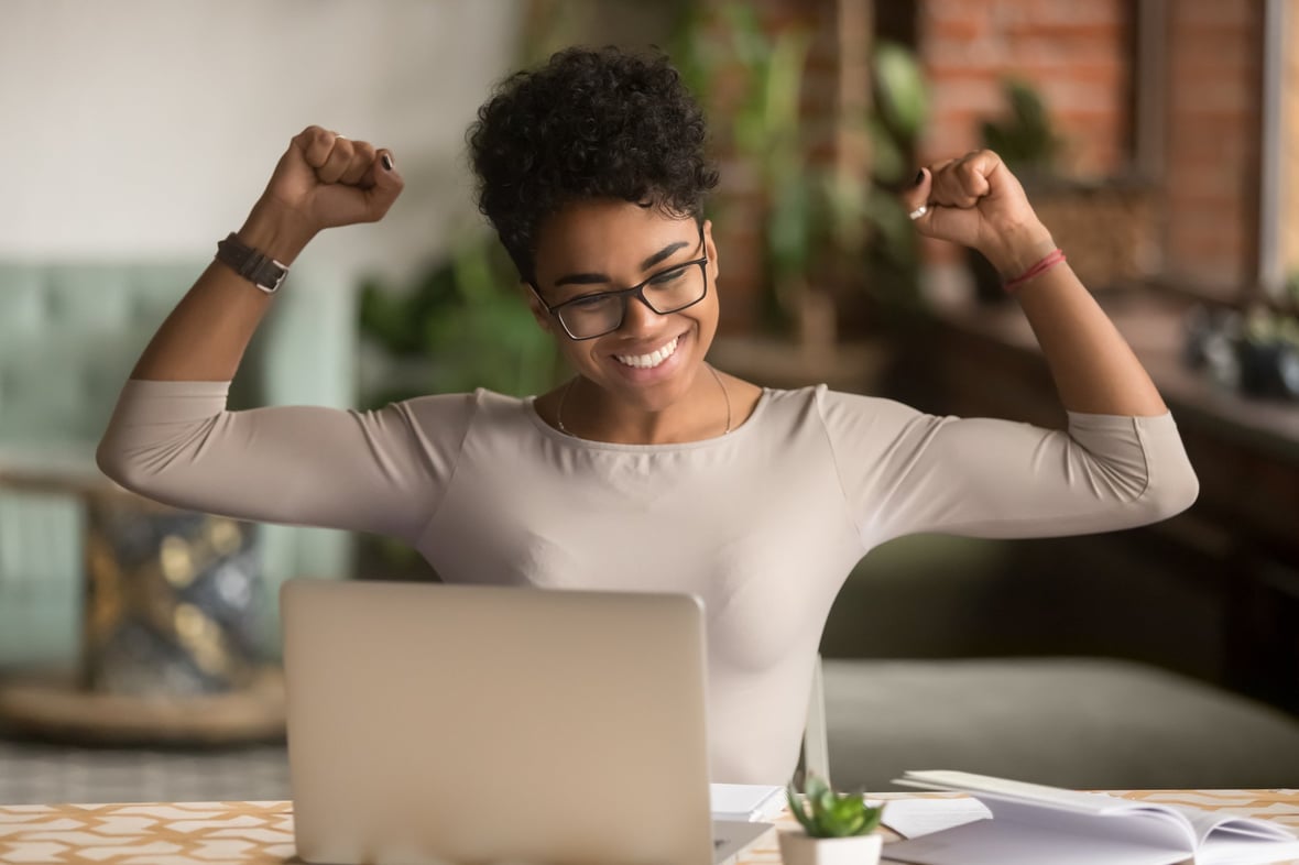 woman celebrating customer aquisition