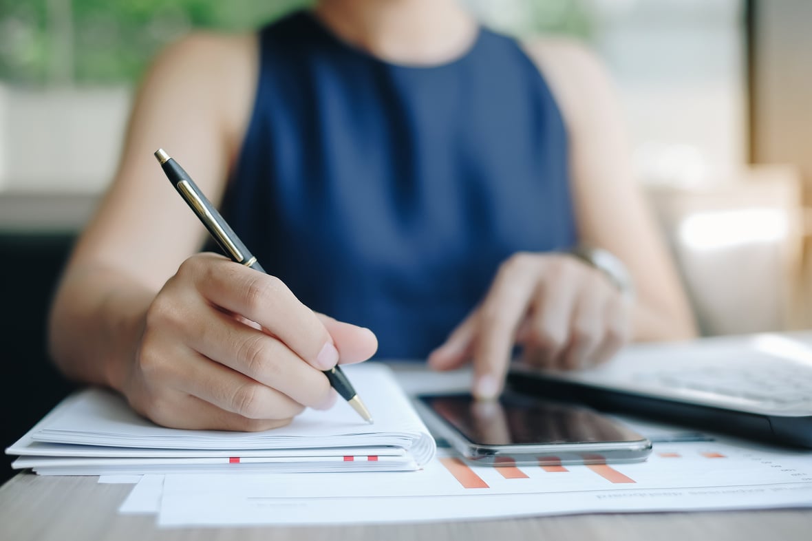 Woman writing a report on PR