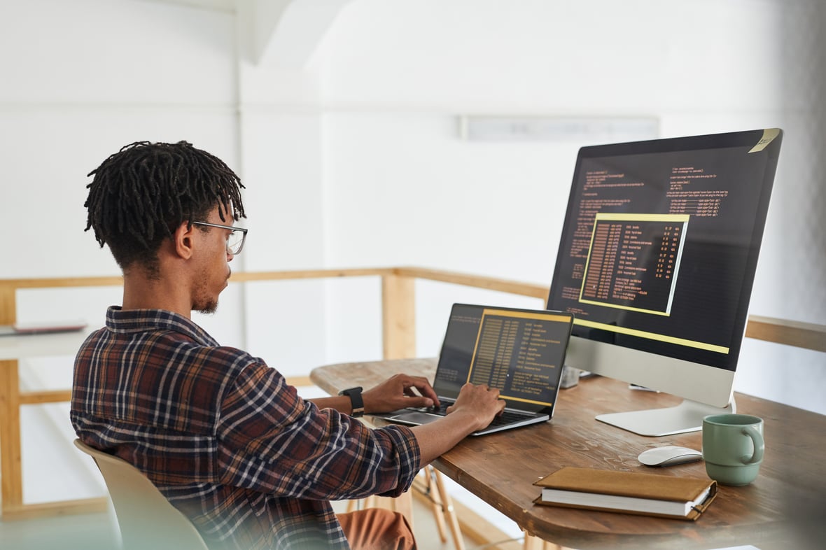 men in front of a computer