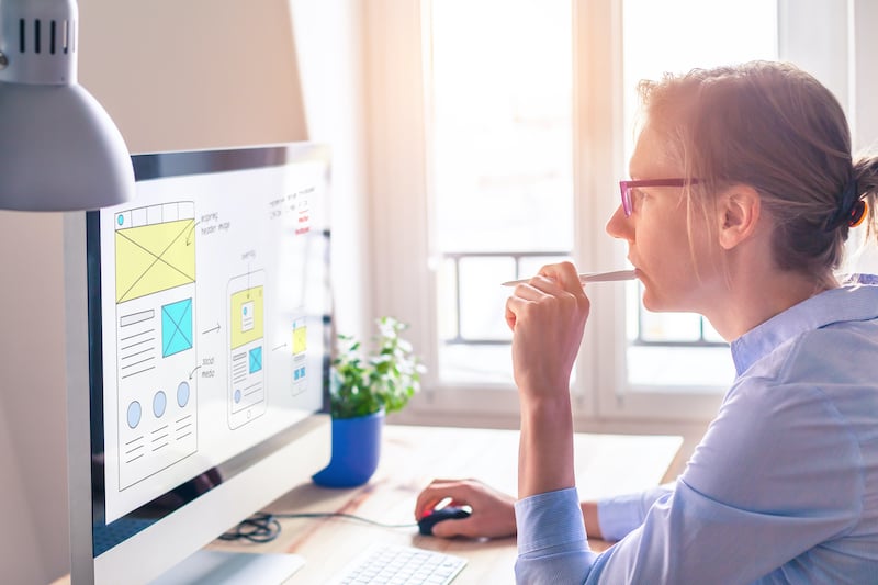 Website designer sketching website layout