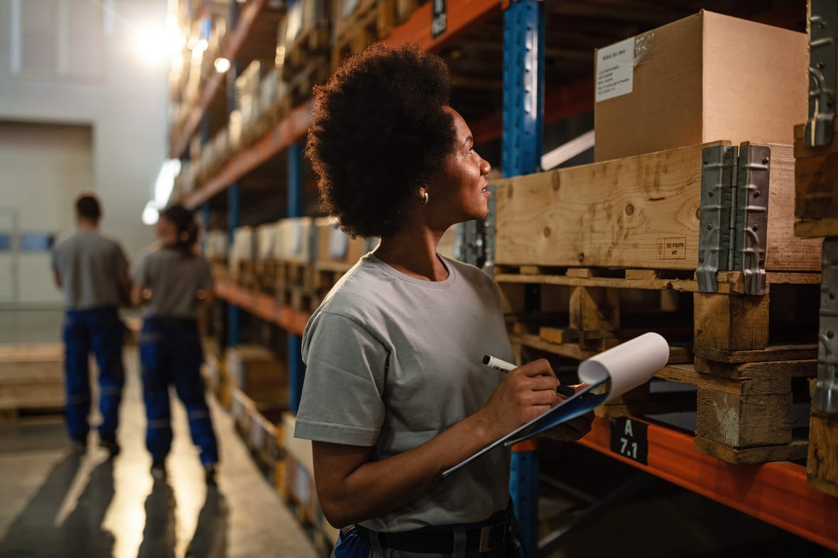 Manufacturing employee checking inventory