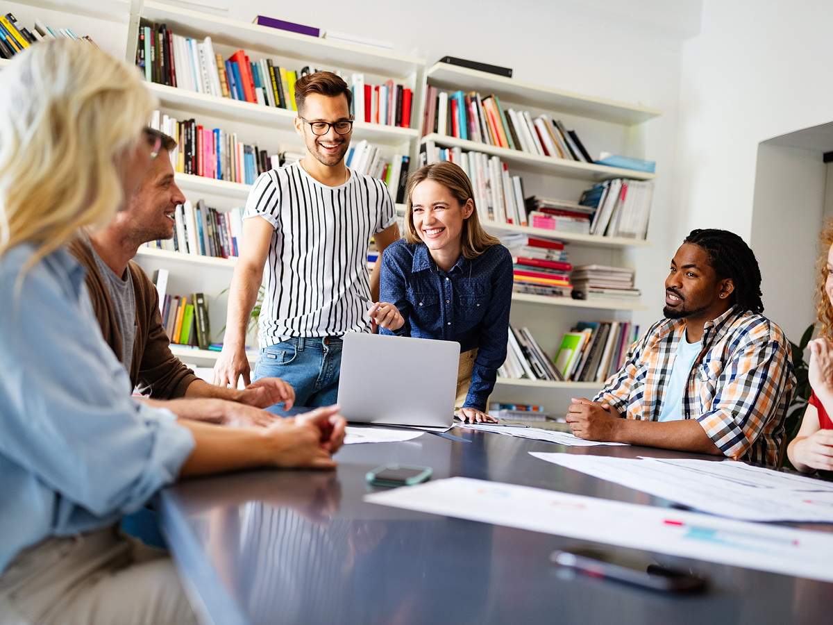 Image of a group of care coordinators un a meeting room