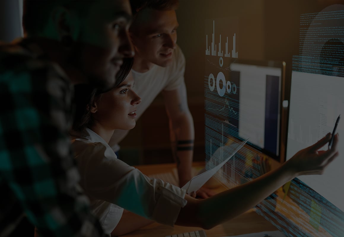 Colleagues viewing analytics with software