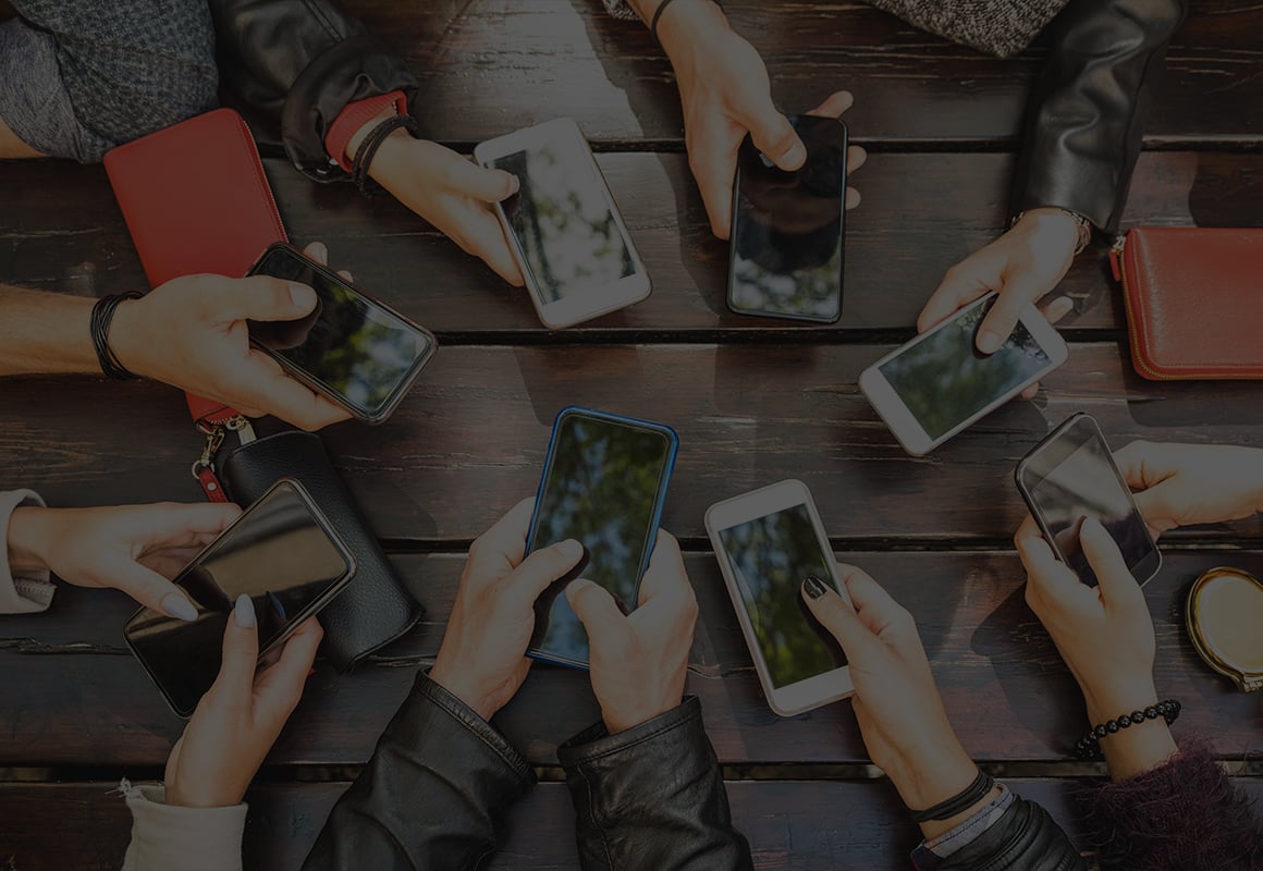 Group of people using phones