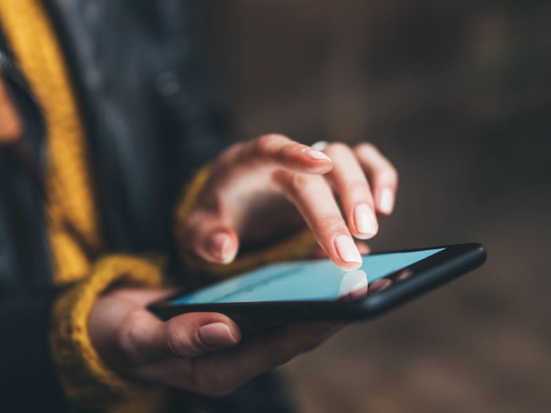 Closeup of a person scrolling on a smartphone