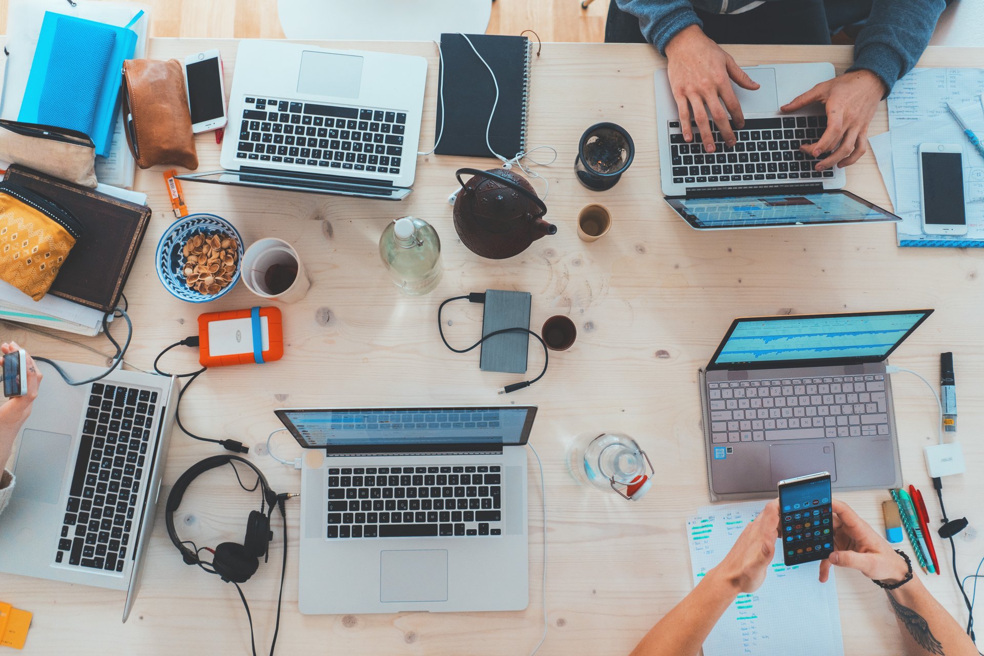 various laptops and devices on a table