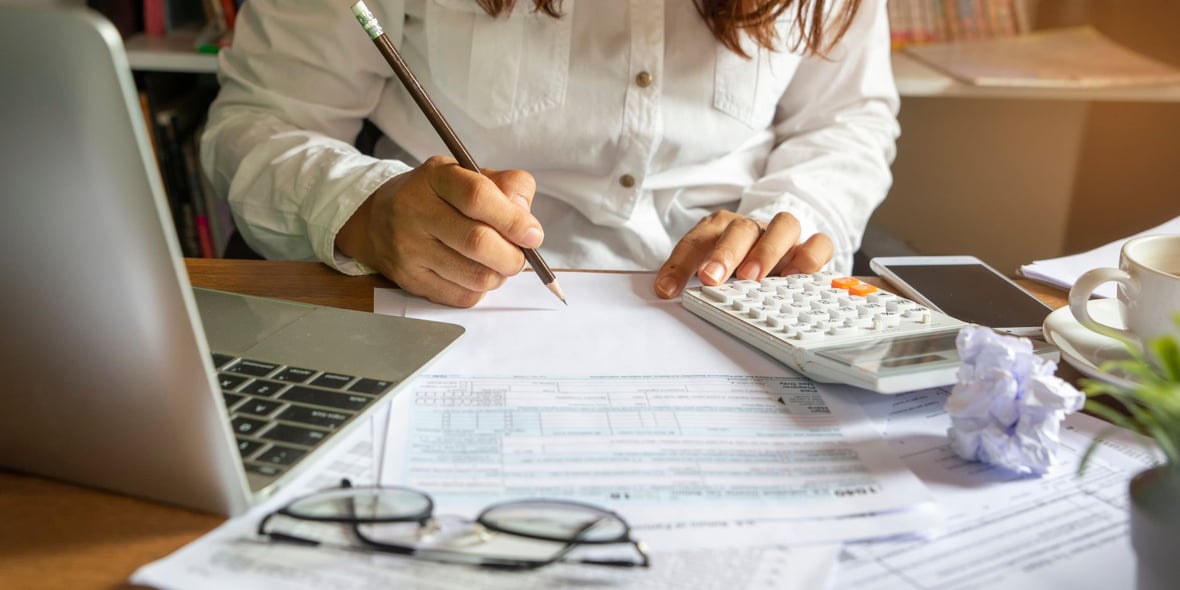 Woman working on her year-end marketing budget 